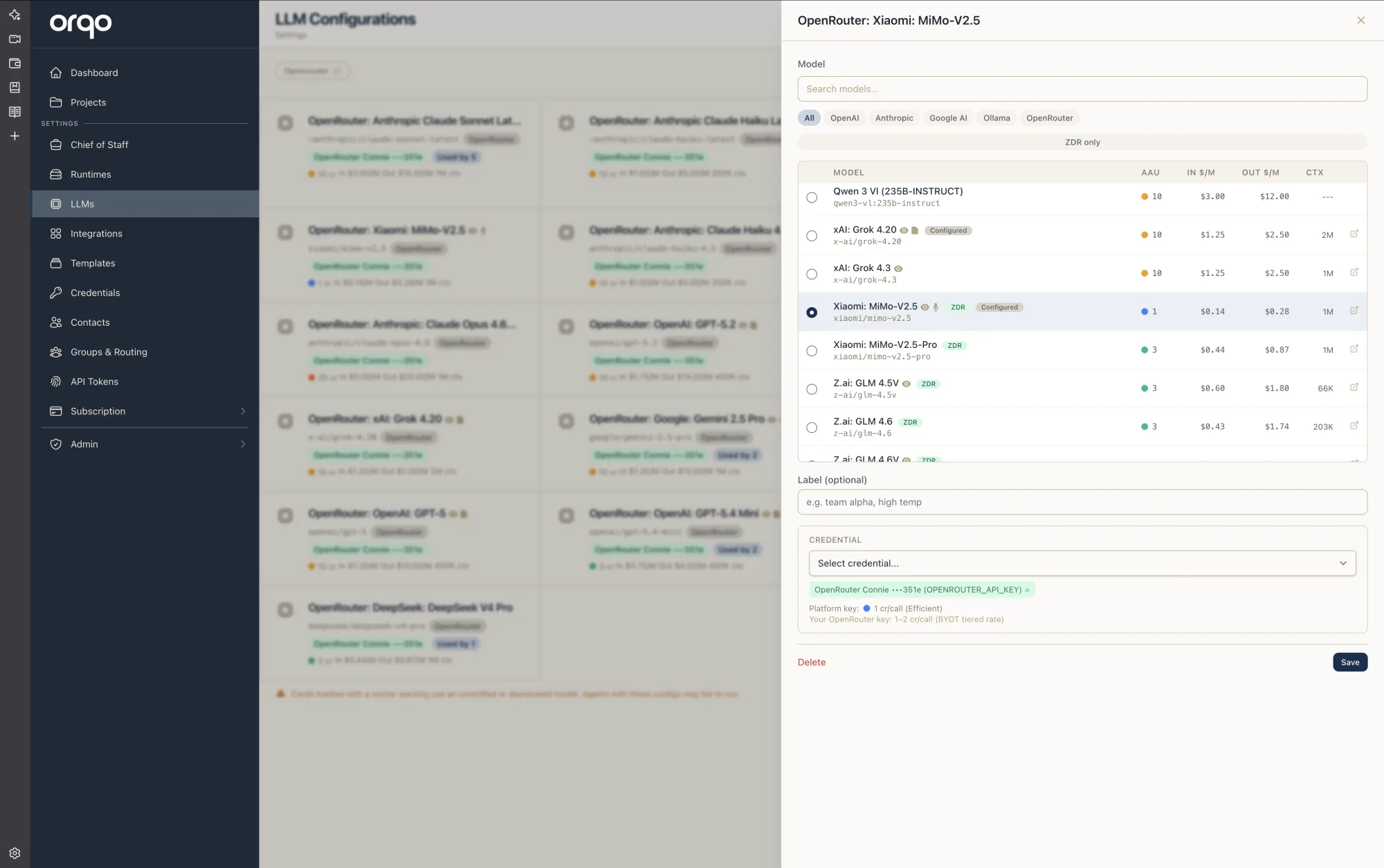 The model picker drawer — search and provider filters at the top, a sortable table of models with capability icons and badges, and the credential section at the bottom